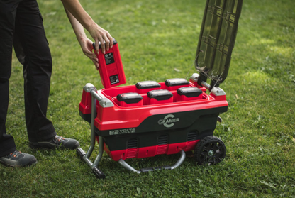 Red and Black Cramer 82V Professional 6 Slot Rapid Charging Station in use