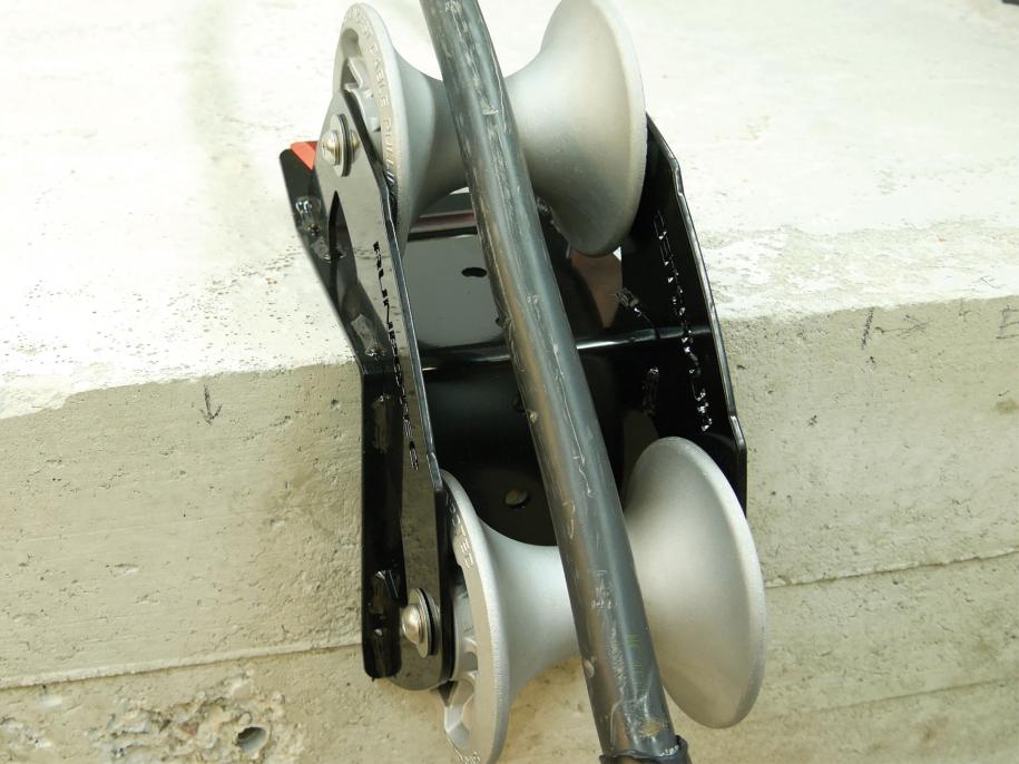 The cable guide roller - 90 degrees is ideally suited for use on various edges to pull cables gently around corners with the least possible resistance. Example photo of roller attached to the corner of a concrete block