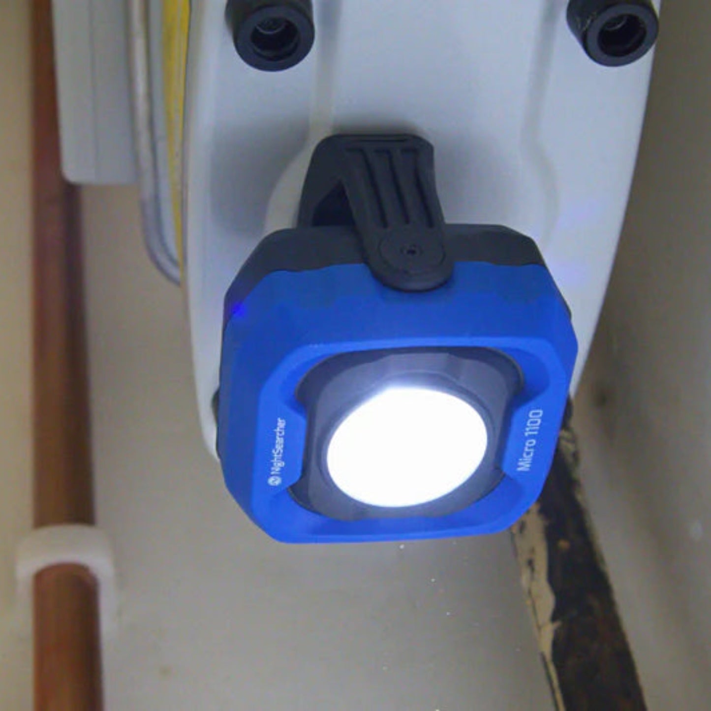 Blue and Black NightSearcher Micro 1100 - 1100 Lumens - Rechargeable Work Light in use